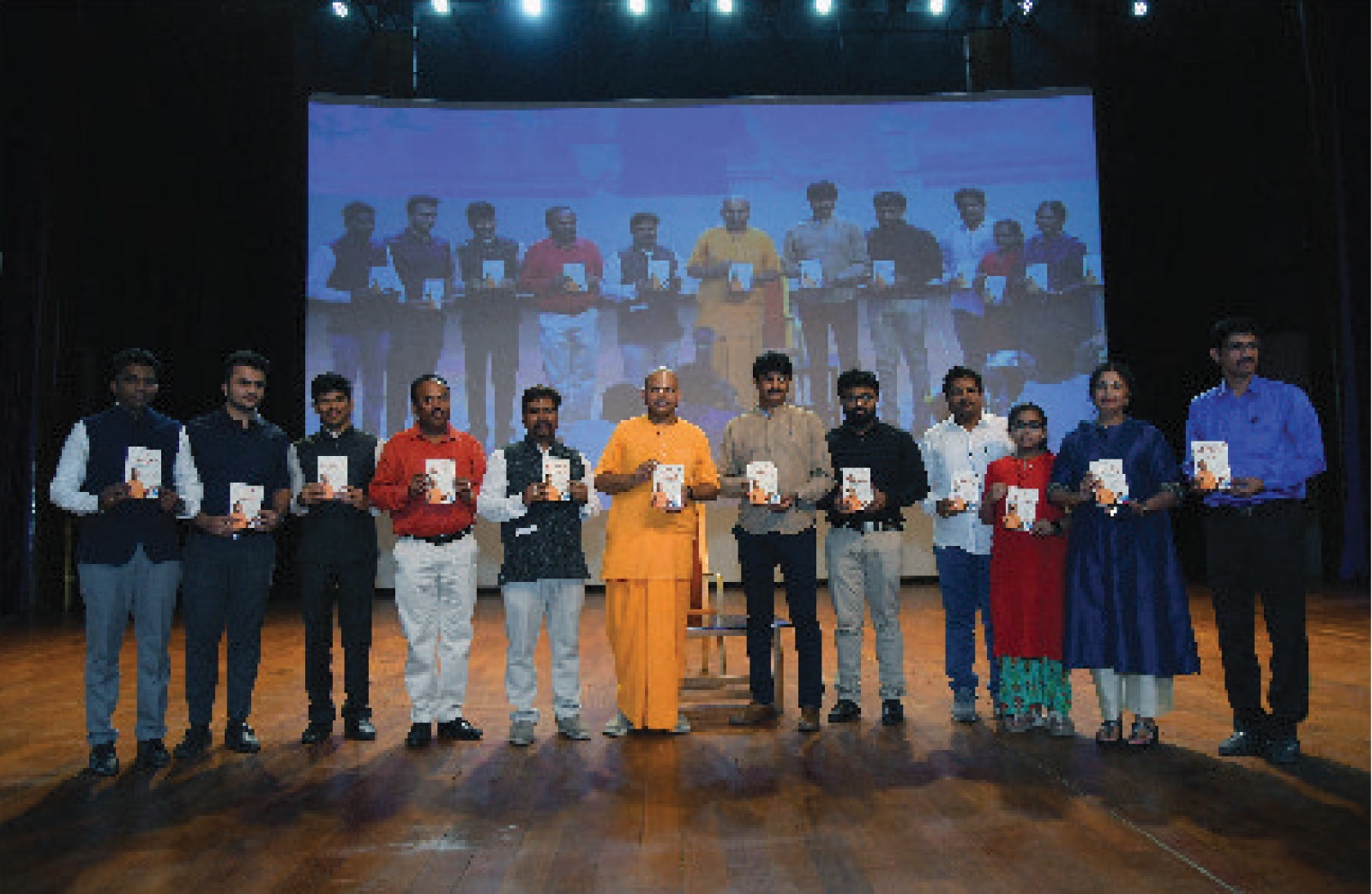 Book launch on stage with dignitaries