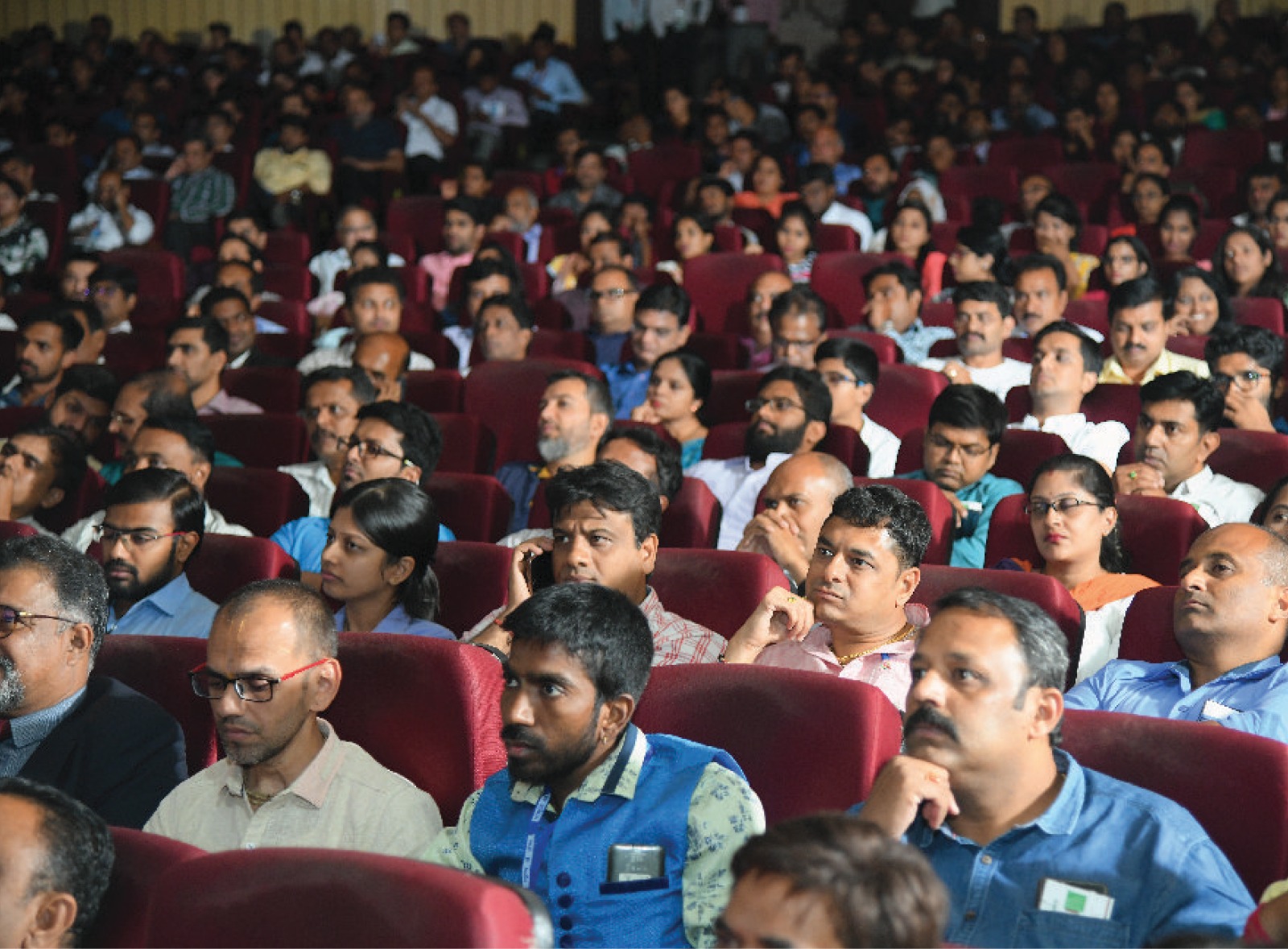 Audience attentively listening at the auditorium